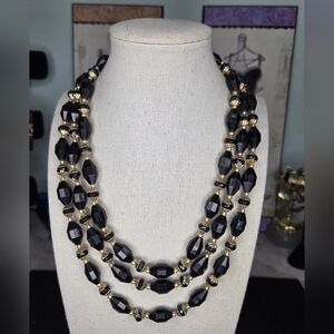Vintage Hong Kong triple-strand necklace featuring faceted black Beads And GT